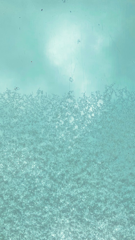 hail on a rooflight, the sky beyond